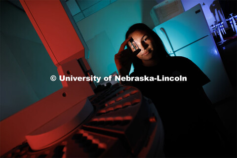 Anastasia Spruce looks through a vial for a gas chromatography mass spectrometer in Filley Hall. Spr