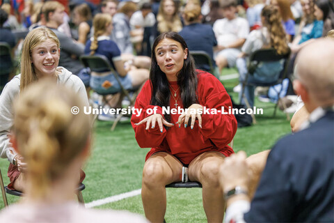 An expressive Bailey Ostlund of Omaha talks during a discussion on the best way of taking notes duri