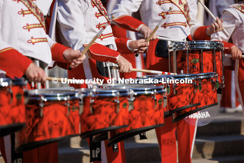 Battery percussion warm-up on Sheldon Museum of Art west steps. Northern Illinois football in Memori