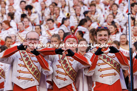 Members of the Husker Marching Band make hearts for the football team. Northern Illinois football in