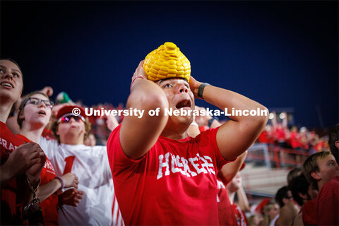 Dillon Parker, a freshman from California, cheers on the Huskers. Northern Illinois football in Memo