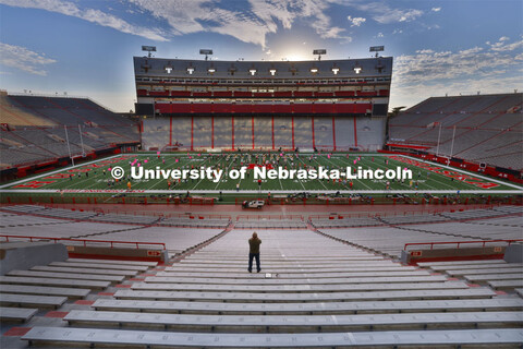 Doug Bush, assistant director of bands, directs the Tuesday morning rehearsal. Cornhusker Marching B