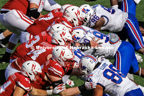 The Nebraska football players hold off Louisiana Tech after the ball is hiked. Nebraska football vs.