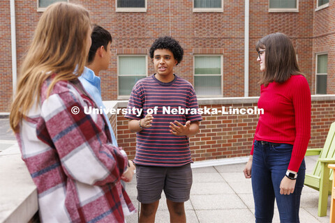 Raikes School students socialize on the rooftop patio of the Kauffman Academic Residential Center. R