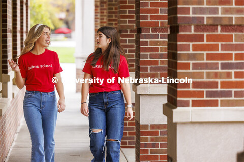 Raikes students walking through the outdoor corridors of the Kauffman Academic Residential Center on