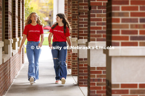 Raikes students walking through the outdoor corridors of the Kauffman Academic Residential Center on