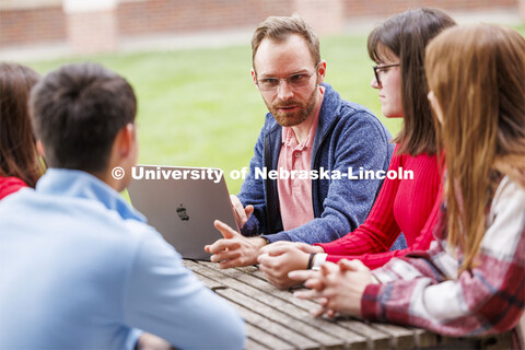 Assistant Professor Seth Polsley holds class outdoors of the Kauffman Academic Residential Center. R