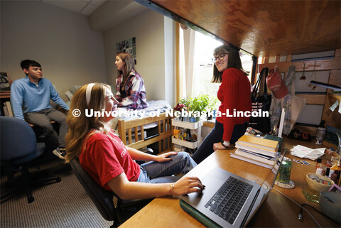 Students hangout together in a  Kauffman Academic Center dorm room. Raikes School photo shoot. Octob