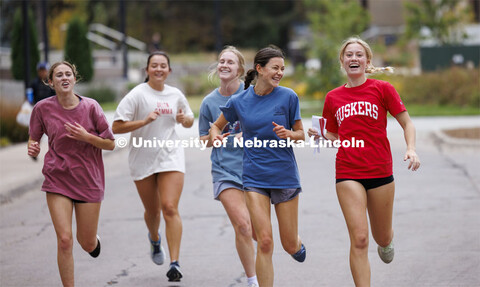 Team Delta Gamma runs through East Campus collecting their clues. Homecoming Traditions Race. Regist