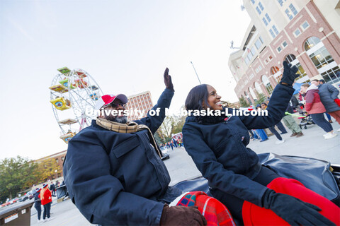 Chancellor Rodney Bennett and his wife, Temple, wave to the crowd as the parade passes Memorial Stad