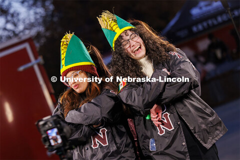 Monica Samaniego, left, and Solenne Halman Gonzalez wear corn hats and their Lambda Theta Nu sororit