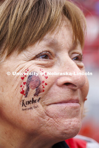 Cari Cohn-Morros wears a temporary tattoo of her daughter, Rachel Morros. Rachel is one of this year