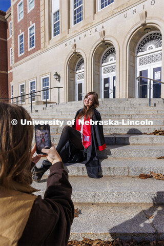 Madison Kindig, a graduating senior in psychology from Olathe, Kansas, has her graduation photos tak