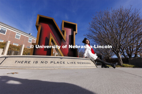 Madison Kindig, a graduating senior in psychology from Olathe, Kansas, has her graduation photos tak