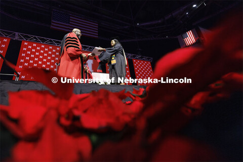 Marlenia Jewell Thornton receives her MBA diploma from Chancellor Rodney Bennett. Graduate Commencem