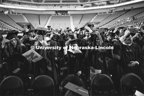 New graduates turn their tassels. Graduate Commencement at Pinnacle Bank Arena. December 15, 2023. 