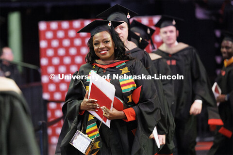 Marlenia Jewell Thornton walks during the recessional. Graduate Commencement at Pinnacle Bank Arena.