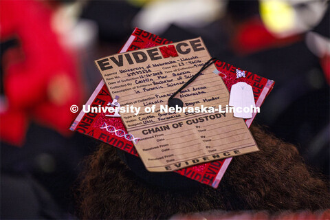 Caitlin Garcia wears the evidence of her college experience on her mortar board. Winter undergraduat