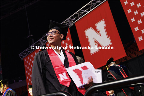 Zoyace Shrestha waves to family and friends after receiving his Engineering degree. Winter undergrad