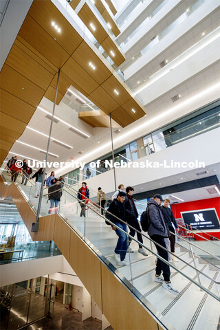 A long straight staircase separates the first and second floor before the stairs wind up the east si