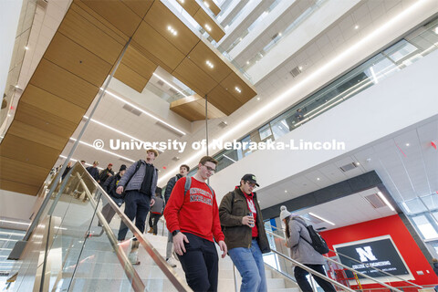 A long straight staircase separates the first and second floor before the stairs wind up the east si