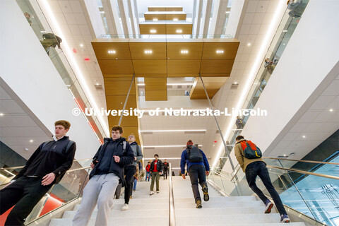 A long straight staircase separates the first and second floor before the stairs wind up the east si