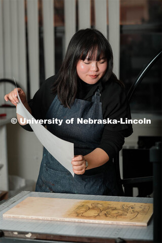 Amy Curtis, a junior in art, in printmaking class in Woods Art Building creates a printed piece. Jan