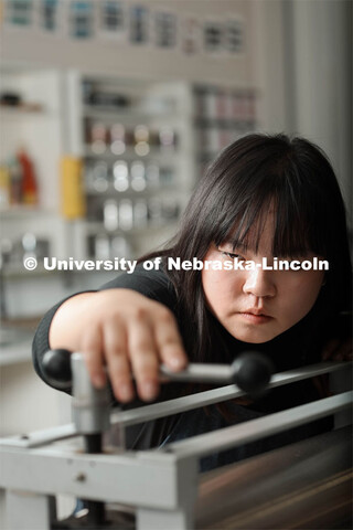 Amy Curtis, a junior in art, in printmaking class in Woods Art Building creates a printed piece. Jan