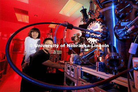 Xia Hong, left, and Yifei Hao work with a pressure vessel in Hong’s Jorgensen Hall lab. Hong’s t