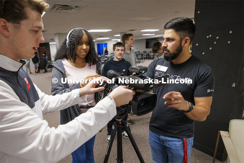 Alex Fernando checks to see if Lefler Middle School student Kaleigh Stockard-Smith can hear the inte