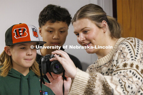 College of Journalism and Mass Communications Ambassador Faith Worden helps students look at their p