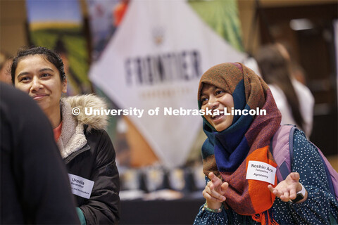 Urmila Manandhar and Noshin Ara Tunazzina talk with recruiters at the East Campus Career Fair. Febru