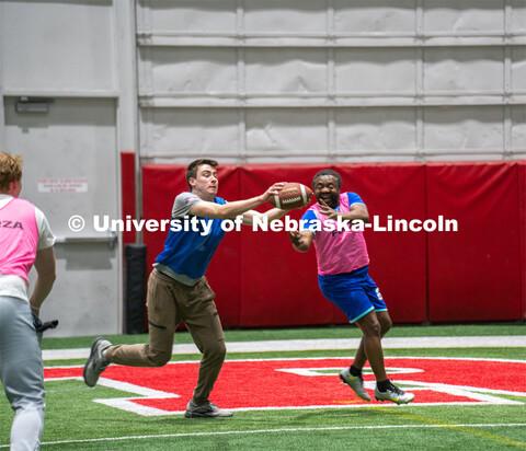 University of Nebraska-Lincoln student Luke Walker intercepts the ball from Professor Jean Marcel Ng