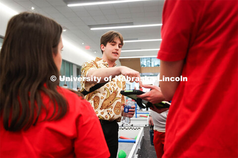 UNL Robotics Club President, Karson Swartzbaugh instructs volunteers. 2024 VEX Robotics Outreach Tou