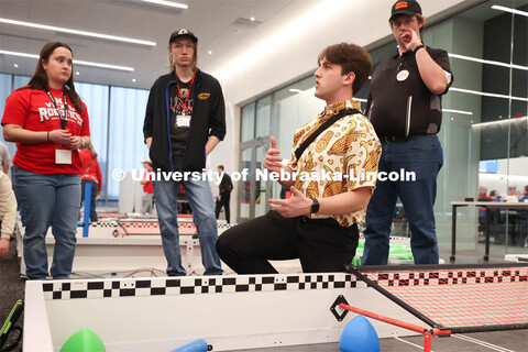 UNL Robotics Club President, Karson Swartzbaugh instructs volunteers. 2024 VEX Robotics Outreach Tou