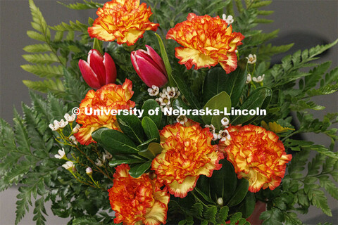 Floral arrangement of carnations and tulips. Stacy Adams teaches PLAS 261 - Floral Design I in the P