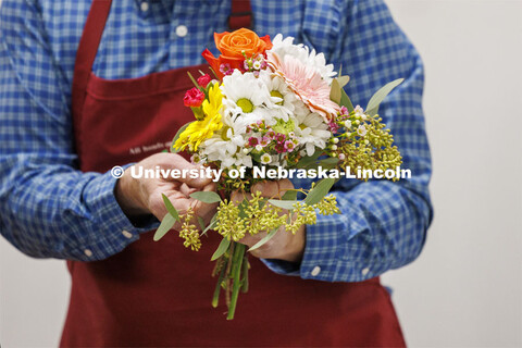 Professor Stacy Adams designs a bouquet like the ones the students will build in PLAS 261 - Floral D