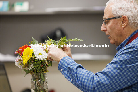 Professor Stacy Adams designs a bouquet like the ones the students will build in PLAS 261 - Floral D