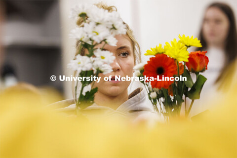 Emily Boyle, a senior Speech-Language Pathologist student designs her bouquet in PLAS 261 - Floral D