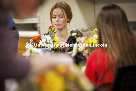 Kaitlin Mack, a senior Finance student designs her bouquet in PLAS 261 - Floral Design I in the Plan