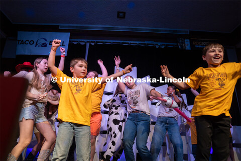 Miracle kids and University of Nebraska-Lincoln students dance on stage at Dance Marathon. Universit