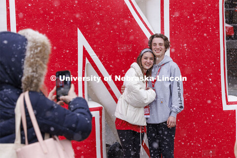 Erin Dodds and Jimmy Reay pose for a photo in front of the inflatable N outside the Nebraska Union. 