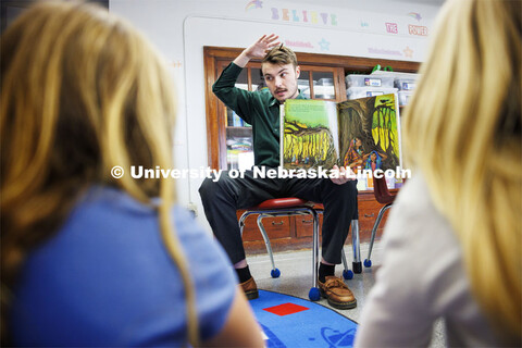 Jack Hilgert, Conservation Education Coordinator for the Nebraska Forest Service, reads a book about