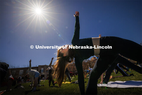 Yoga on the greenspace during the eclipse. The Solar Social party to view the partial solar eclipse 