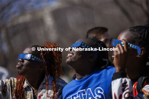 Nyarial Nyoak watches the eclipse with her friends. The Solar Social party to view the partial solar