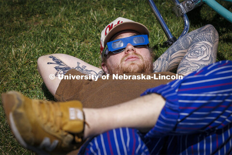 Nico Janda stretched out in the grass to watch the eclipse. The Solar Social party to view the parti