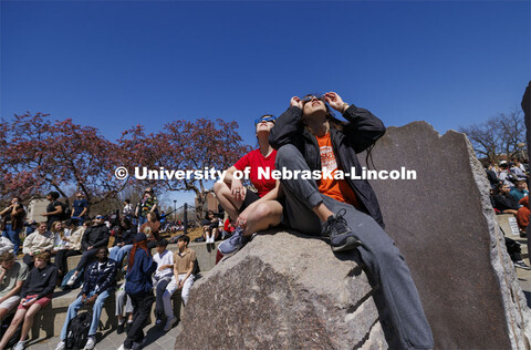 Students view the eclipse from atop of the Broyhill fountain. The Solar Social party to view the par