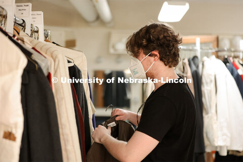 Hunter Rock organizes costumes for cast for the UNL production “Big Fish”. April 22, 2024. 