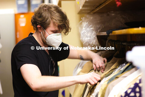 Hunter Rock organizes costumes for cast for the UNL production “Big Fish”. April 22, 2024. 