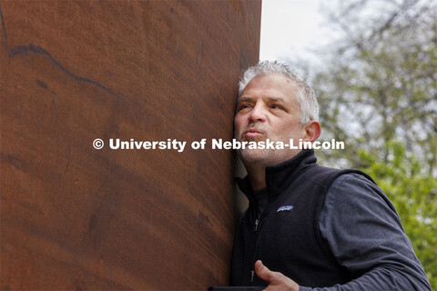 Chip Stanley, lecturer in the College of Architecture, presses his ear against the Greenpoint sculpt